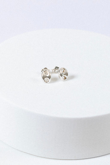 Sterling Silver puff mariner stud earrings on a white background
