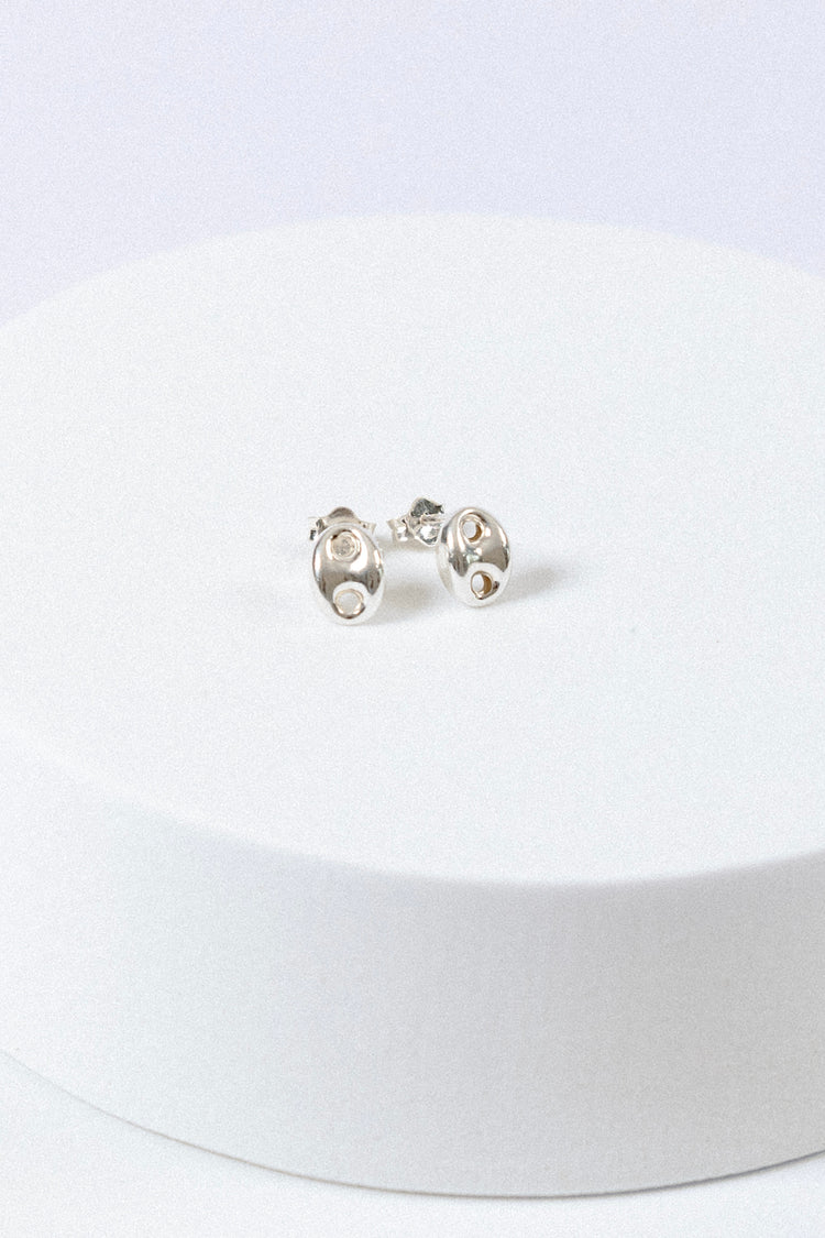 Sterling Silver puff mariner stud earrings on a white background